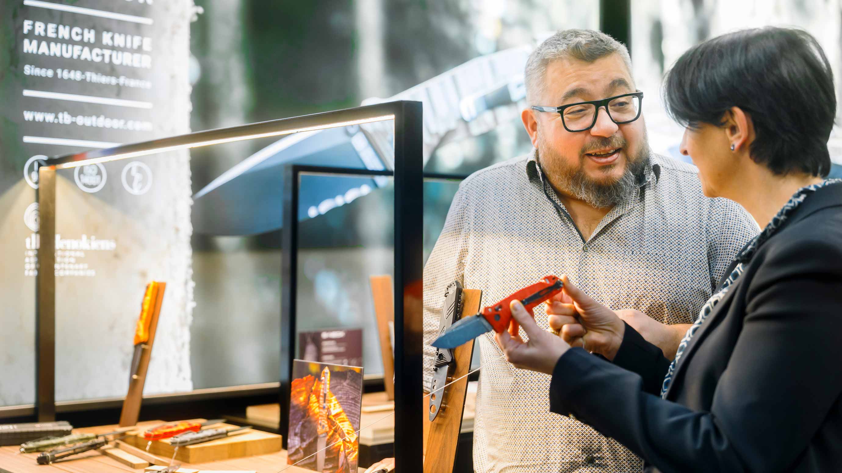 Two people are talking about a knife