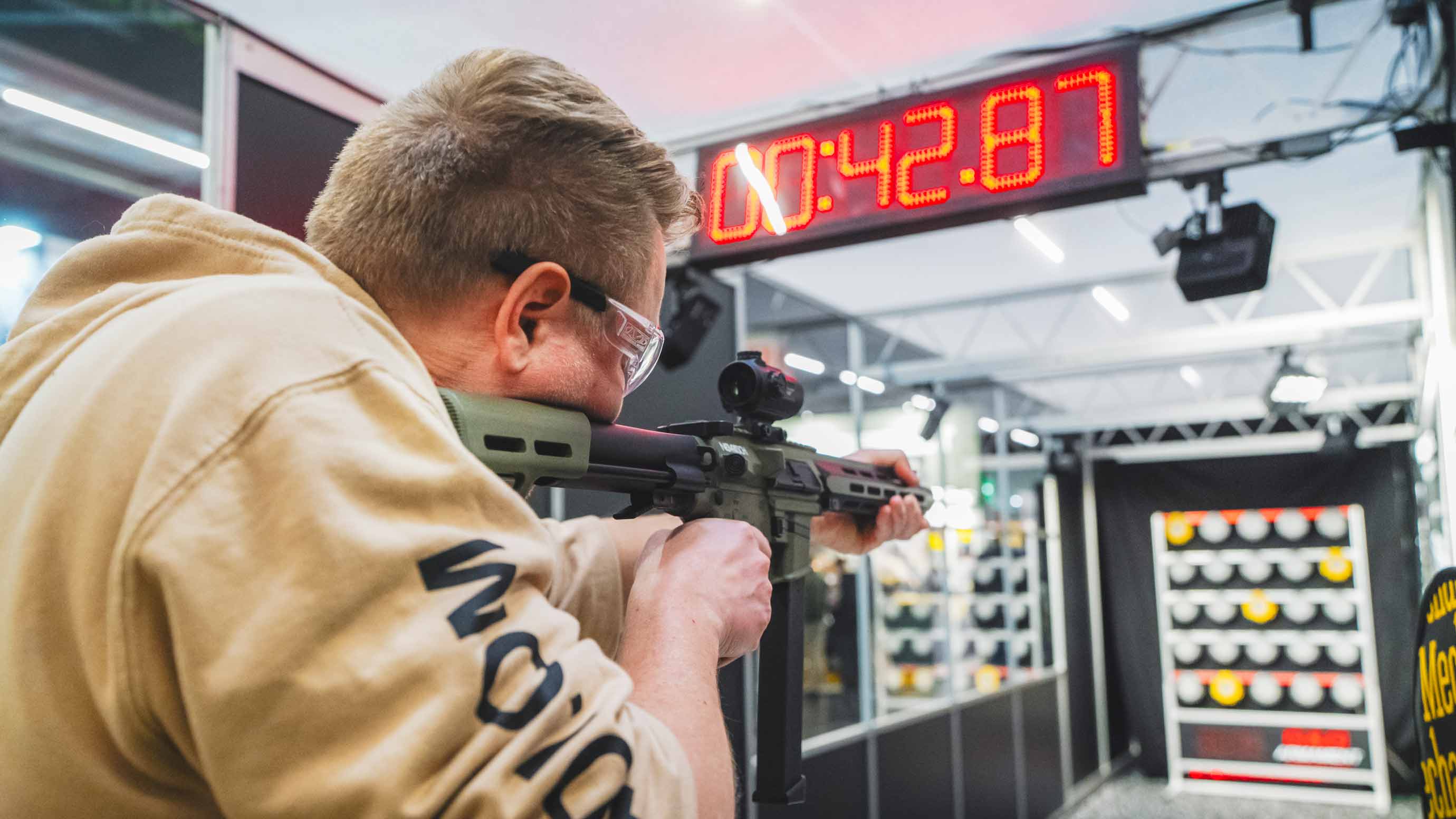 Man testing a weapon at a shooting range